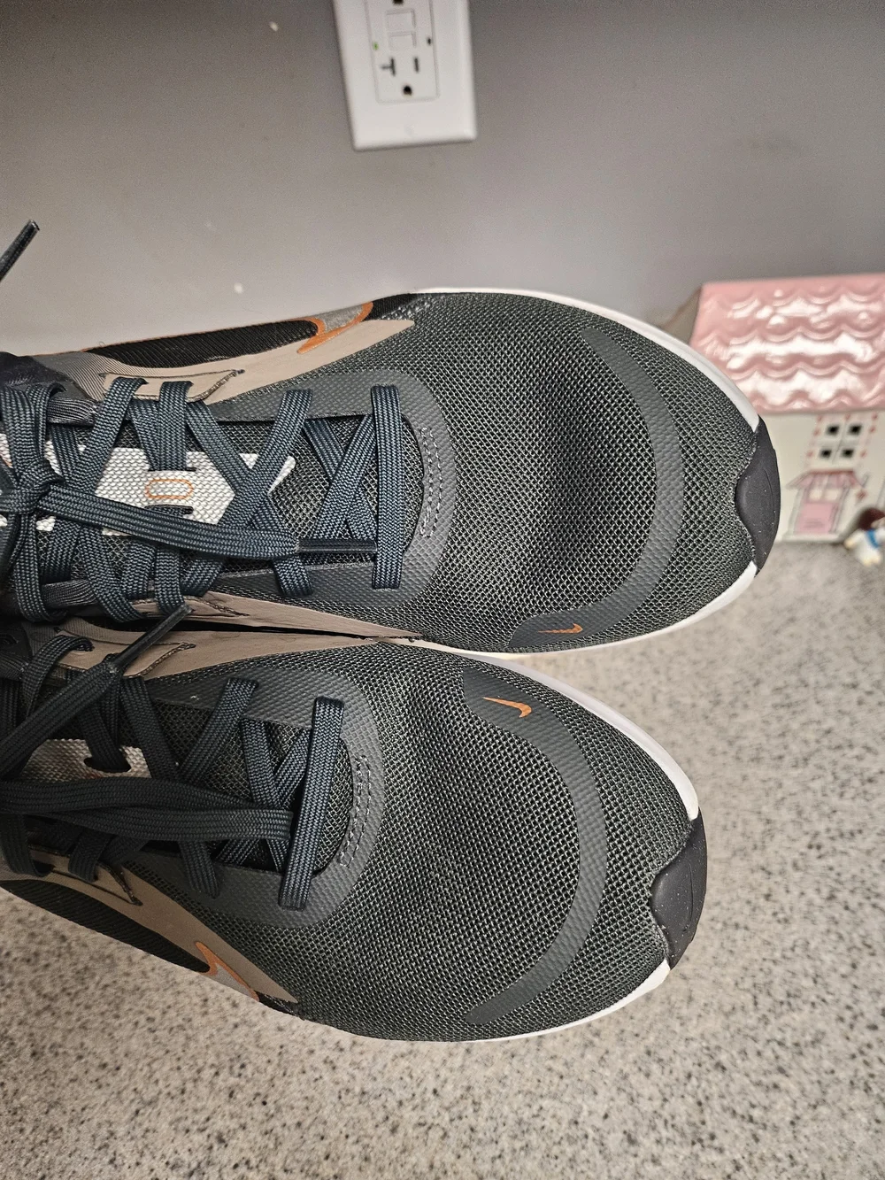 Nike Women's Black Running Shoes with Metallic Orange Swoosh